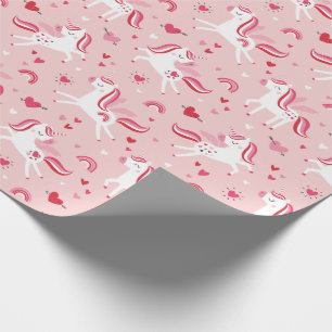 Cute unicorns med regnbågar och hjärtan på rosa presentpapper