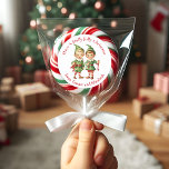 Cute Vintage Elves Holly Jolly Anpassningsbar jul Runt Klistermärke<br><div class="desc">De här vackra julklistermärkena har ett fint par vintagar som tittar julklappar i feststuga och som önskar alla en Holly Jolly-jul. Anpassa genom att lägga till ditt/dina namn. Gör en förtjusande märkre av helgdag!</div>