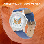 Cute Western Cat och Teal Namn Armbandsur<br><div class="desc">Den här söta designade katthandklockan är för barn. Utformningen inspirerades av det gamla Native American Rio Grande woven matta. Jordens färg omfattar krona, brunkol, turkos och rödlera. Det här ögon-rivet är från en lätt läcka på ansikte. Det finns tealnummer och en namn i matchande teal kan du anpassa. Cute och...</div>