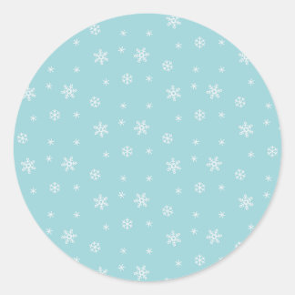 Cyan snöflingemönster runt klistermärke