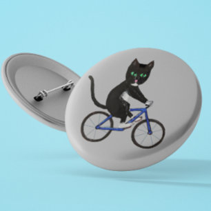 Cyklande katt på en cykel Black and white cat Knapp