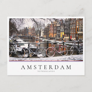 Cyklar i snön i Amsterdam Vykort