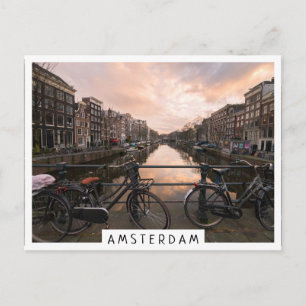 Cyklar vid solnedgången i Amsterdam Vykort
