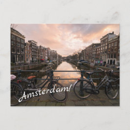 Cyklar vid solnedgången i Amsterdam Vykort