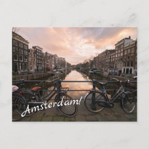 Cyklar vid solnedgången i Amsterdam Vykort