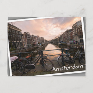 Cyklar vid solnedgången i Amsterdam Vykort