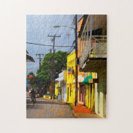 Cykling down Queen Street, Speightstown, Barbados Pussel