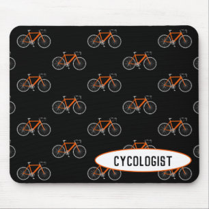cykolog orange cykel på svart musmatta