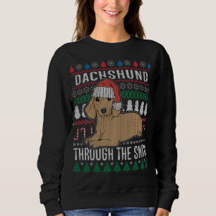 Dachshund genom den Snö fuktiga julsötaren T-shirt