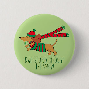 Dachshund genom snö julknapp knapp