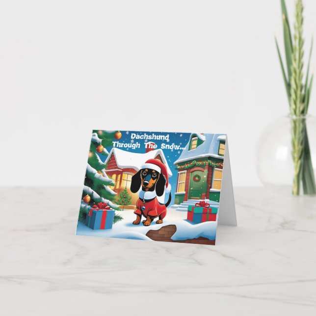 Dachshund genom Snö.. Julkort Helgkort (Framsida)