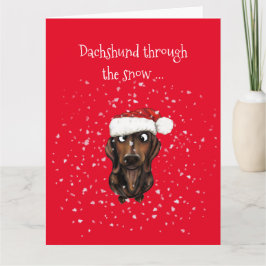 Dachshund genom snö ... Julkort Kort