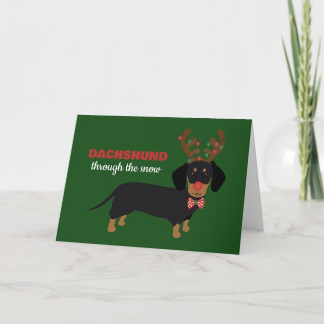 Dachshund genom snö Söt Doxie Renhund Helgkort (Framsida)
