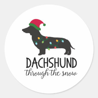 Dachshund genom Snö-stiftelsen, jul Runt Klistermärke