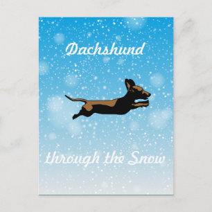 Dachshund genom snö vykort