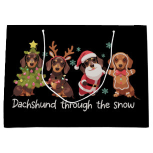 Dachshund genom snön Roliga julhundar