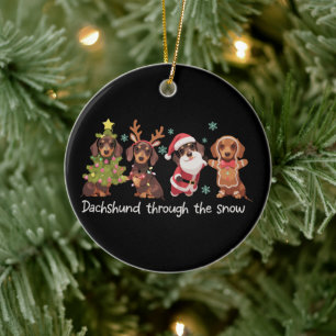 Dachshund genom snön roliga julhundar julgransprydnad keramik