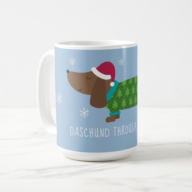 Dachshund i snön - Illustrerad  Kaffe Mugg (Framsida vänster)