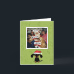 Dachshund jul | Wiener Hund Santa Ditt foto Helgkort<br><div class="desc">Lustigt tecknad Dachshund som bär en julhatt. Lägg till ditt eget foto och Julhälsningar till det här söta Wiener-julkortet. Ett kort för helgdag av roligt personlig för alla på din Julafton-lista. Besök Jenns Doodle World om du vill ha fler coola- och originalpresenter med denna svarta och bekanta Doxie.</div>