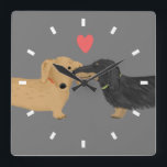 Dachshund Kiss med hjärta | Wiener Hundar Kärlek Fyrkantig Klocka<br><div class="desc">Svart och tan långhårig Doxie och röd kort hade Dachshund med hjärtat. En söt wiener hund älskare väggklocka för hem eller kontor. Gör en perfekt till vilken djurälskare som helst. Besök Jenns Doodle World för ännu fler gåvor från Dachsie älskare och söta tecknader från hund aveln.</div>
