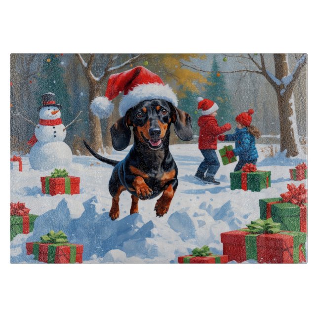 Dachshund springer i snö med julhatt (Framsidan)