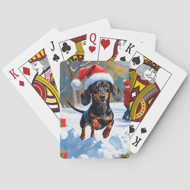Dachshund springer i snö med julhatt casinokort (Baksidan)