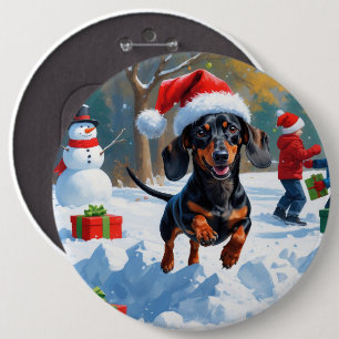 Dachshund springer i snö med julhatt knapp