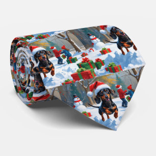 Dachshund springer i snö med julhatt slips