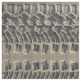 Däck spårar i tyg för strandsandfoto