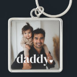 Daddy Heart - First Father's Day Photo  Fyrkantig Silverfärgad Nyckelring<br><div class="desc">Make his first Father's Day unforgettable with a gift that’s as meaningful as it is beautiful. This custom keepsake features your own special photo with the word “daddy” lovingly written across the top—complete with a charming little heart. All text is fully editable, including the color, so you can tailor it...</div>