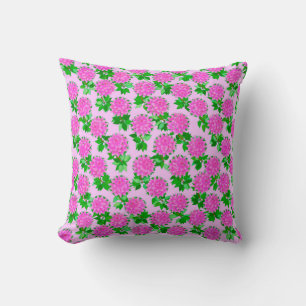Dahlia-blommor på djupt rosa kudde