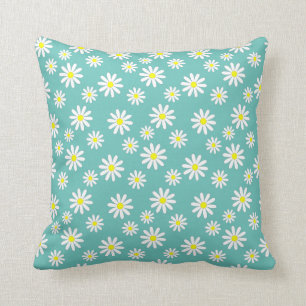 Daisyblommor på en blå kudde