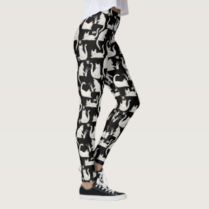 Dålig katter som knackar Saker över, vit katter på Leggings