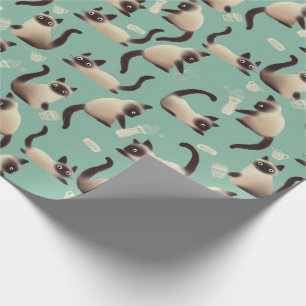 Dåliga siamesiska katter som knackar Saker över Presentpapper