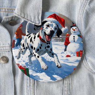 Dalmatiner springer i snö med julhatt knapp