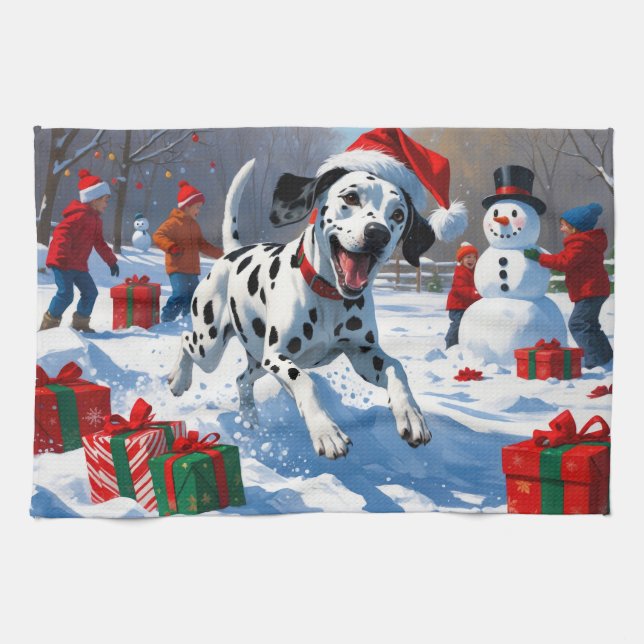 Dalmatiner springer i snö med julhatt kökshandduk (Horisontell)