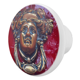 DAM HEAD BRASS DOOR KNOCKER (PHOTOG).ON RED KNOPP