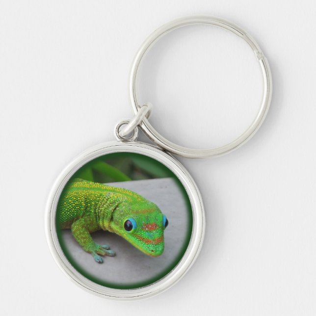 Dammdagen i Guld - Audition och lite Gecko Rund Silverfärgad Nyckelring (Framsidan)