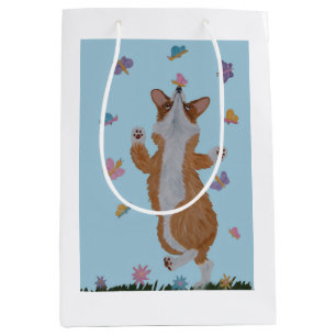 Dansande Welsh Corgi med fjärilar