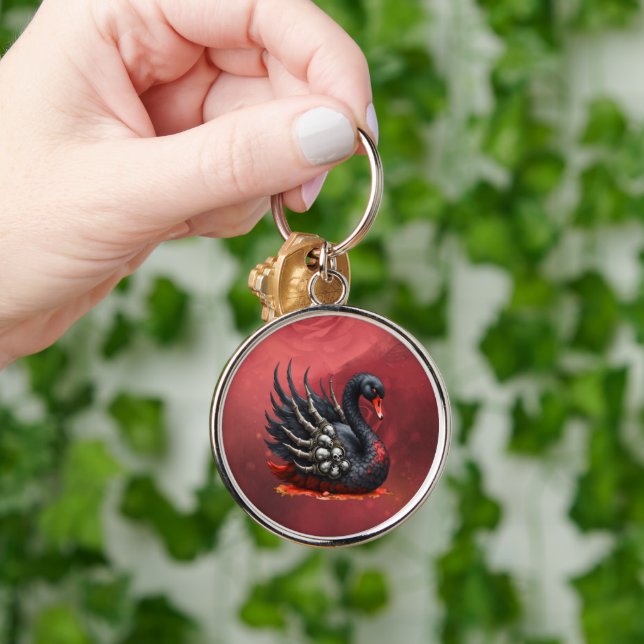 Dark Swan of Bones – Gothic Elegance  Rund Silverfärgad Nyckelring (Hand)