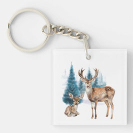 Deer and doe with snowy pine tree
