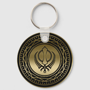 Dekorativt Khanda symbolguld på svart Nyckelring