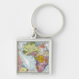 DELADE AFRIKA, 1914 FYRKANTIG SILVERFÄRGAD NYCKELRING