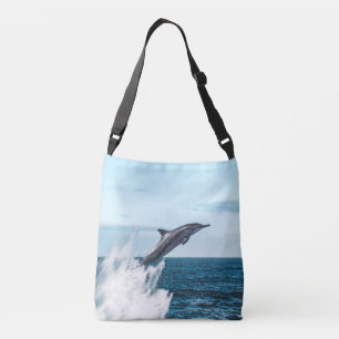 Delfin hoppar upp ur havet axelväska