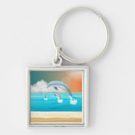 Delfiner som bryter i havet fyrkantig silverfärgad nyckelring