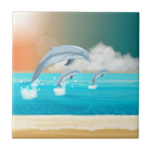 Delfiner som bryter i havet