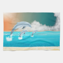 Delfiner som bryter i havet