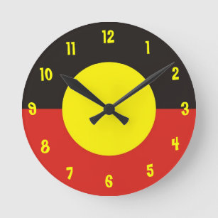 den aboriginal flagga tar tid på rund klocka