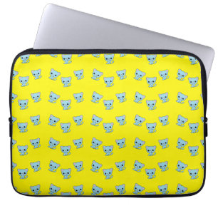 Den blå kattungen på gulten laptop fodral