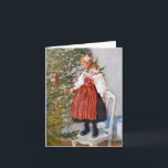 Den Carl Larsson julgranen noterar kort<br><div class="desc">Tittar Larssons målningar lämnar alltid mig känsla förnyad, och denna är inget undantag. Jag älskar den behagfulla linjer, känslan av lugna förväntan, och avkänningen av en lycklig familj som denna målning frammanar. Tom insida. Beskrivning: Blond flicka för söt en lite i traditionella folk kostymerar stativ på en stol att tillfoga...</div>